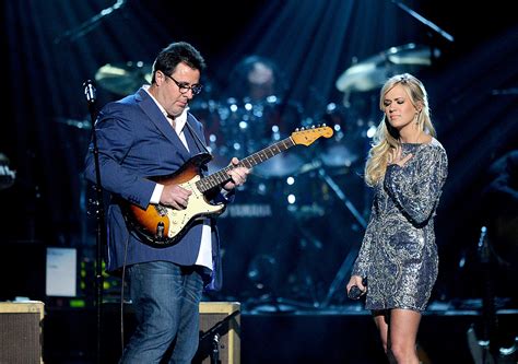 listen to carrie underwood how great thou art: How does the music of Carrie Underwood reflect the themes of faith and redemption found in How Great Thou Art?